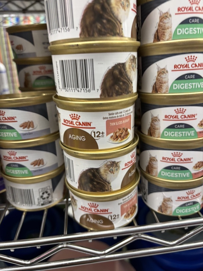 Royal Canin Aging 12+ and Digestive Care canned cat food on a shelf